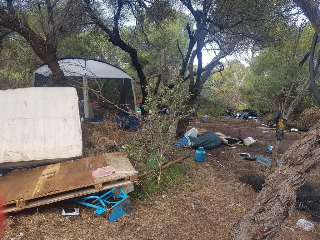 Here is a photo of Kwinana's Squatter Camp. You can see the rubbish and mattrasses lying on the ground.
